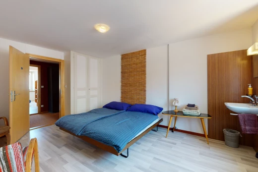 bedroom with hardwood flooring