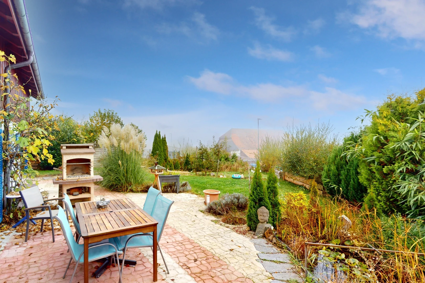patio / terrace with an outdoor fireplace, a patio area, and a mountain view