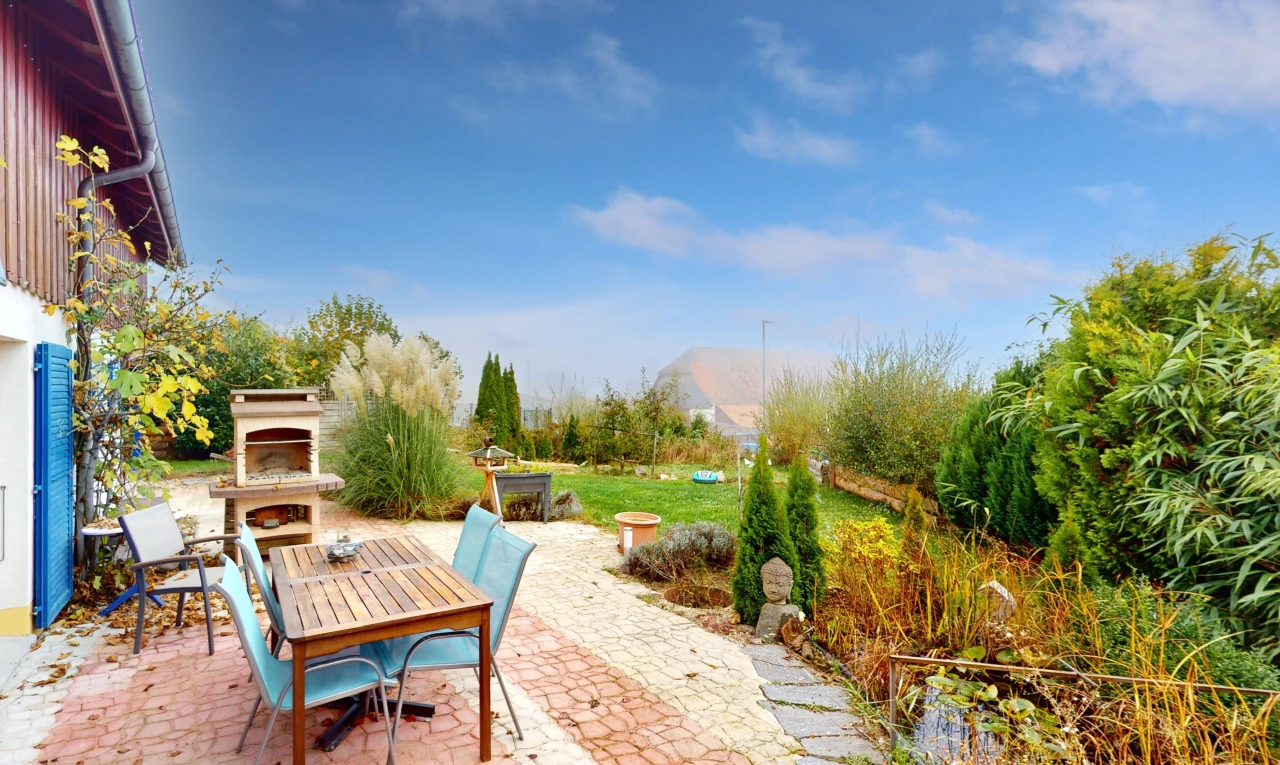 patio / terrace with an outdoor fireplace, a patio area, and a mountain view