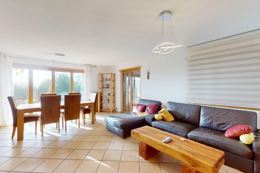 living / dining room featuring an inviting chandelier and light tile patterned flooring