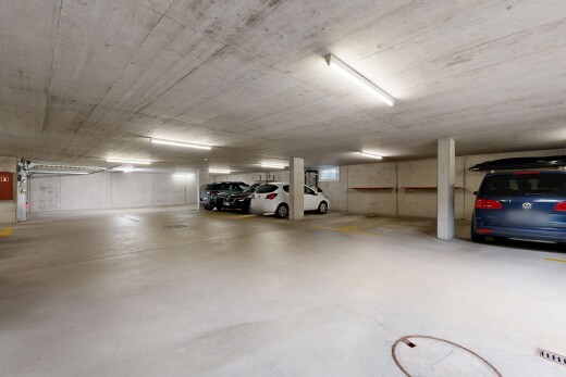 view of parking with a parking deck