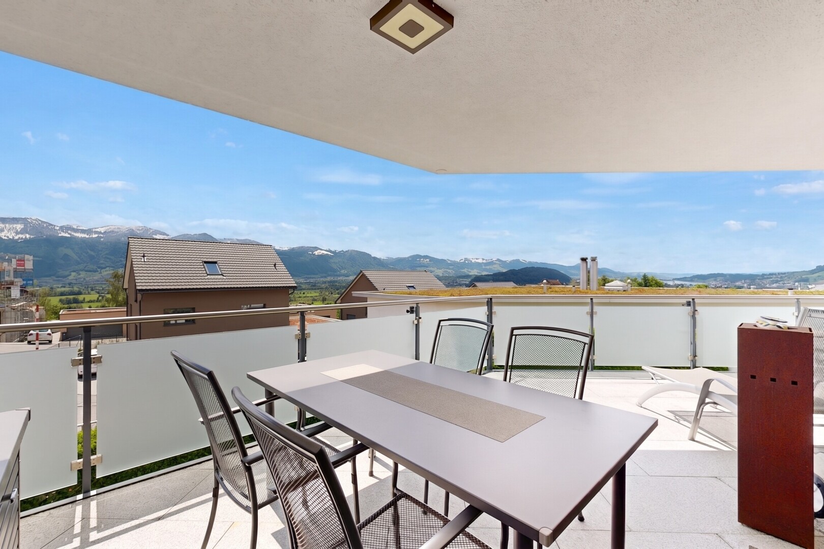 terrace featuring a patio, a mountain view, and outdoor dining area