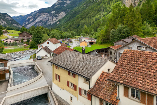 view of home featuring stucco siding, a mountain view, and a residential view
