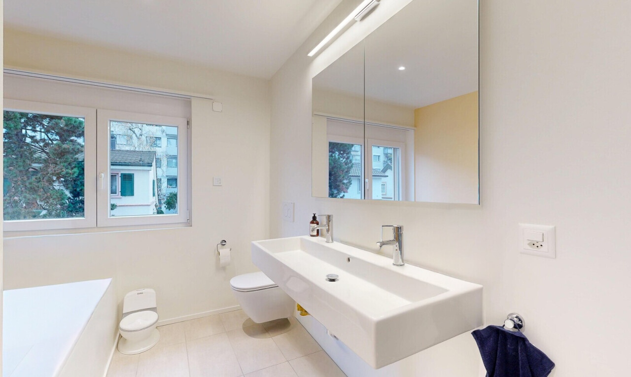 bathroom with a bath, light tile patterned floors, plenty of natural light, vanity, and recessed lighting