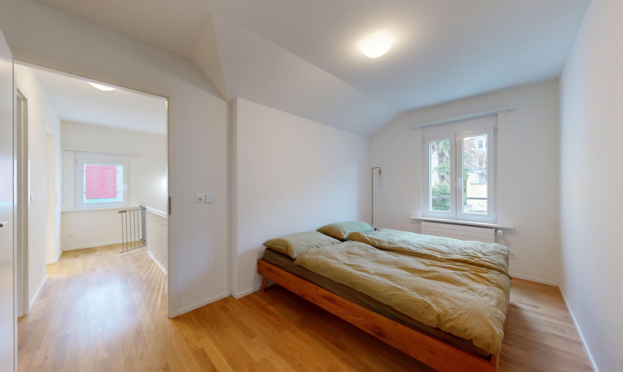 room / bedroom with light wood-style floors, vaulted ceiling, and multiple windows