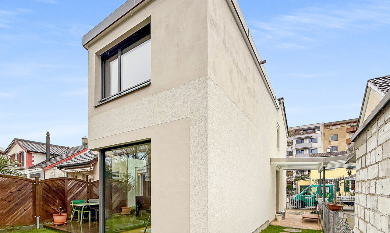 outdoor house featuring a fenced backyard, stucco siding, and a gate