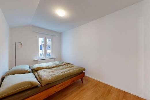 room / bedroom with vaulted ceiling and wood finished floors