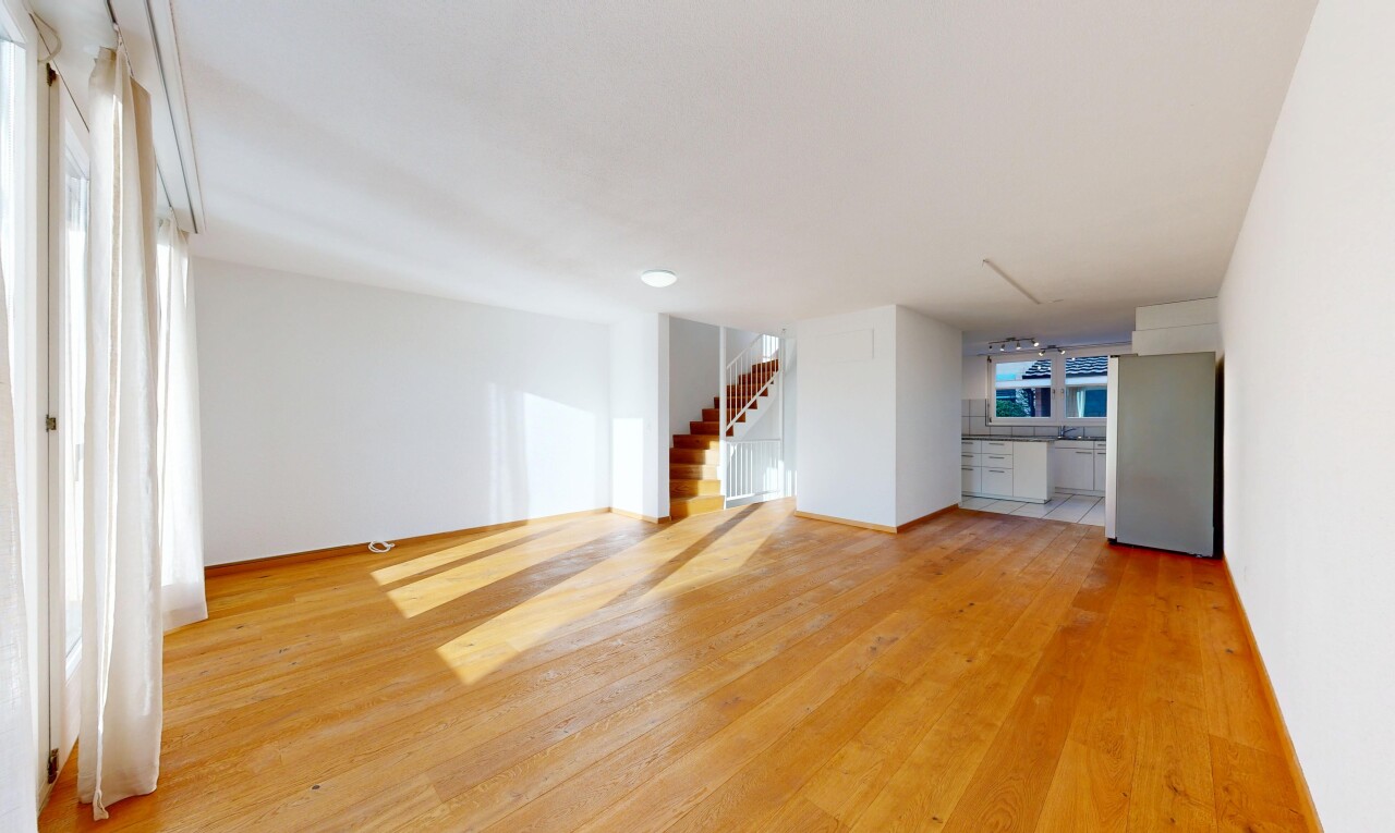 unfurnished room with stairs and light wood-style floors