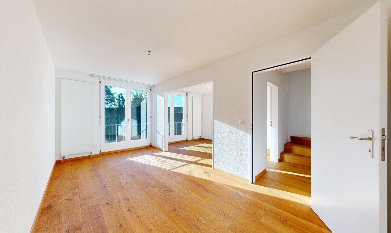 empty room featuring light wood-style floors and stairway