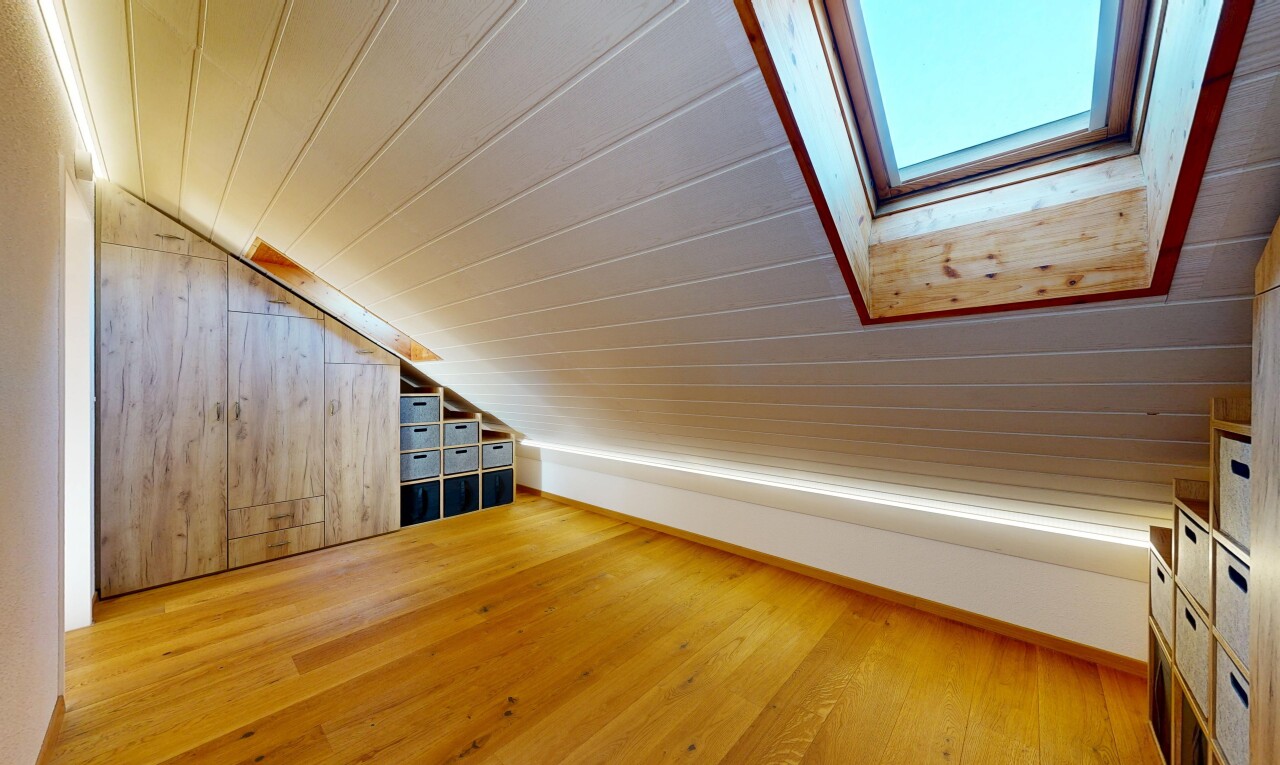 unfurnished room featuring a vaulted wood ceiling, light wood-style floors, and wooden walls