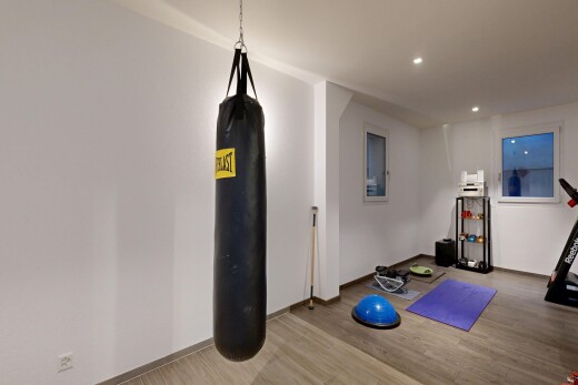gym with recessed lighting and light wood-style floors