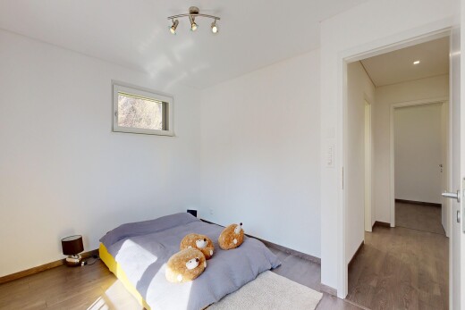 chambre avec cloison sèche, drywall, sol en finition bois, wood finish floor, et inside property