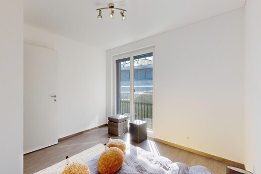 spare room with light wood-style flooring and baseboards