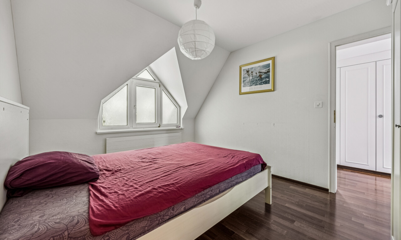 room / bedroom featuring dark wood-style flooring and lofted ceiling