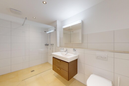 bathroom with tile walls, a walk in shower, vanity, recessed lighting, and light tile patterned floors
