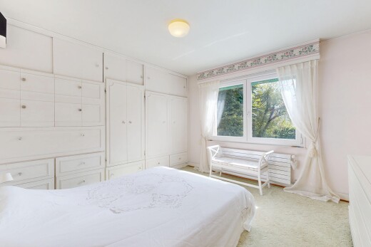 room / bedroom featuring light carpet