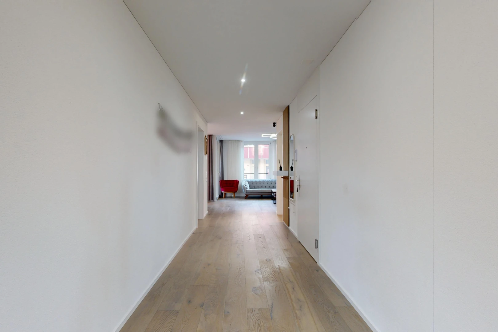 hallway featuring light wood-type flooring and recessed lighting