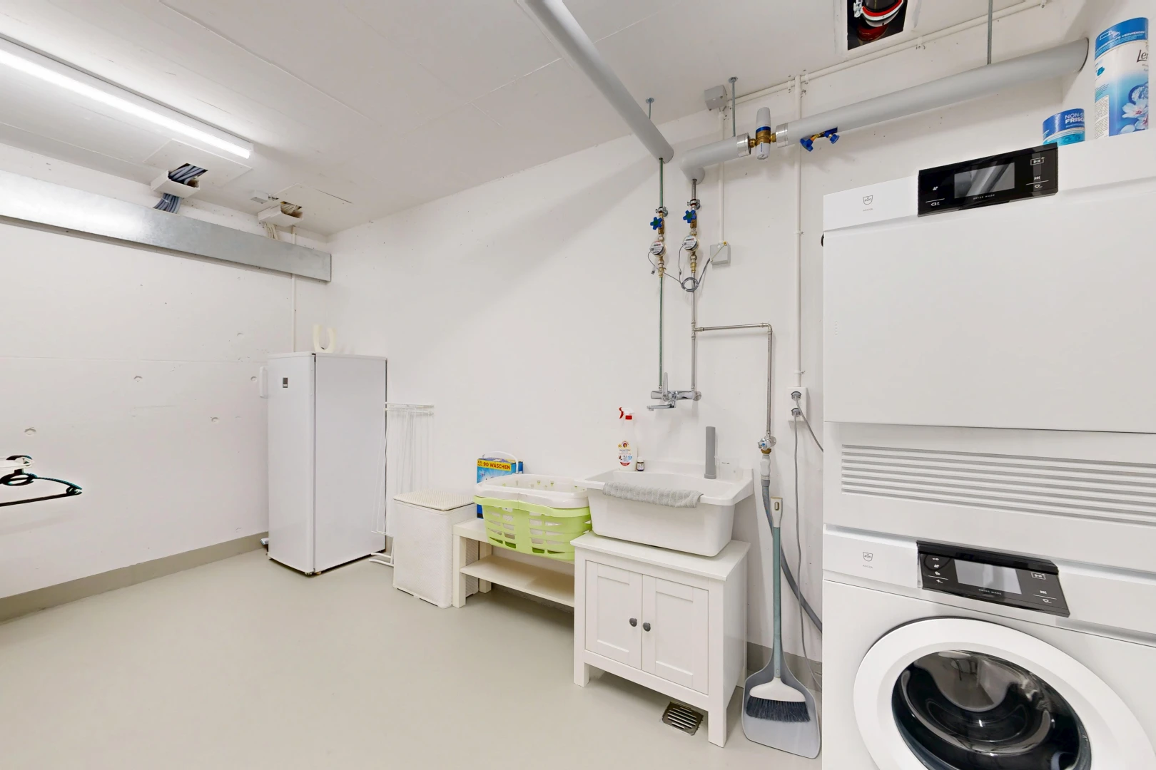 laundry room with washer / dryer and a sink