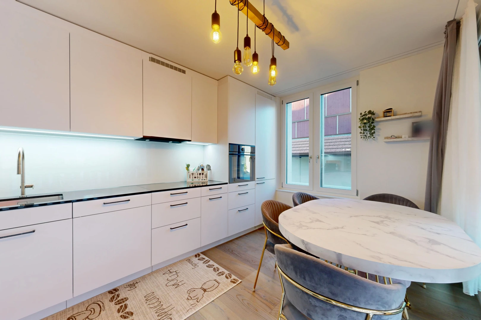 kitchen featuring modern cabinets, white cabinets, dark countertops, oven, and light wood finished floors