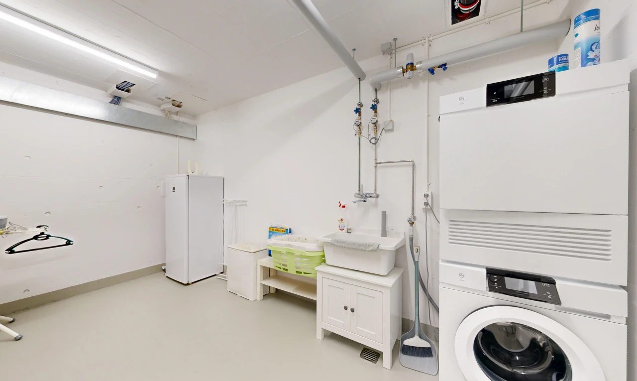 laundry room with washer / dryer and a sink
