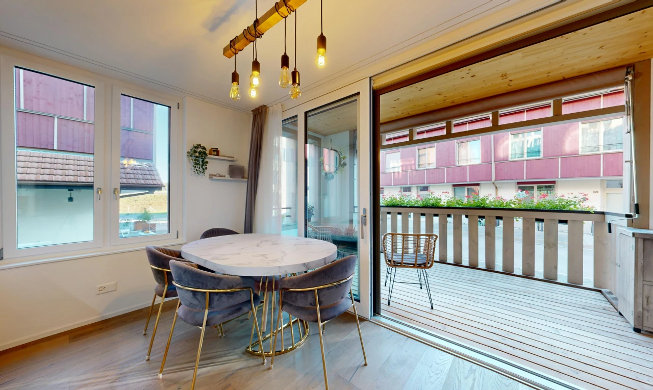 dining space featuring access to outside, light wood-style flooring, crown molding, and pendant lighting