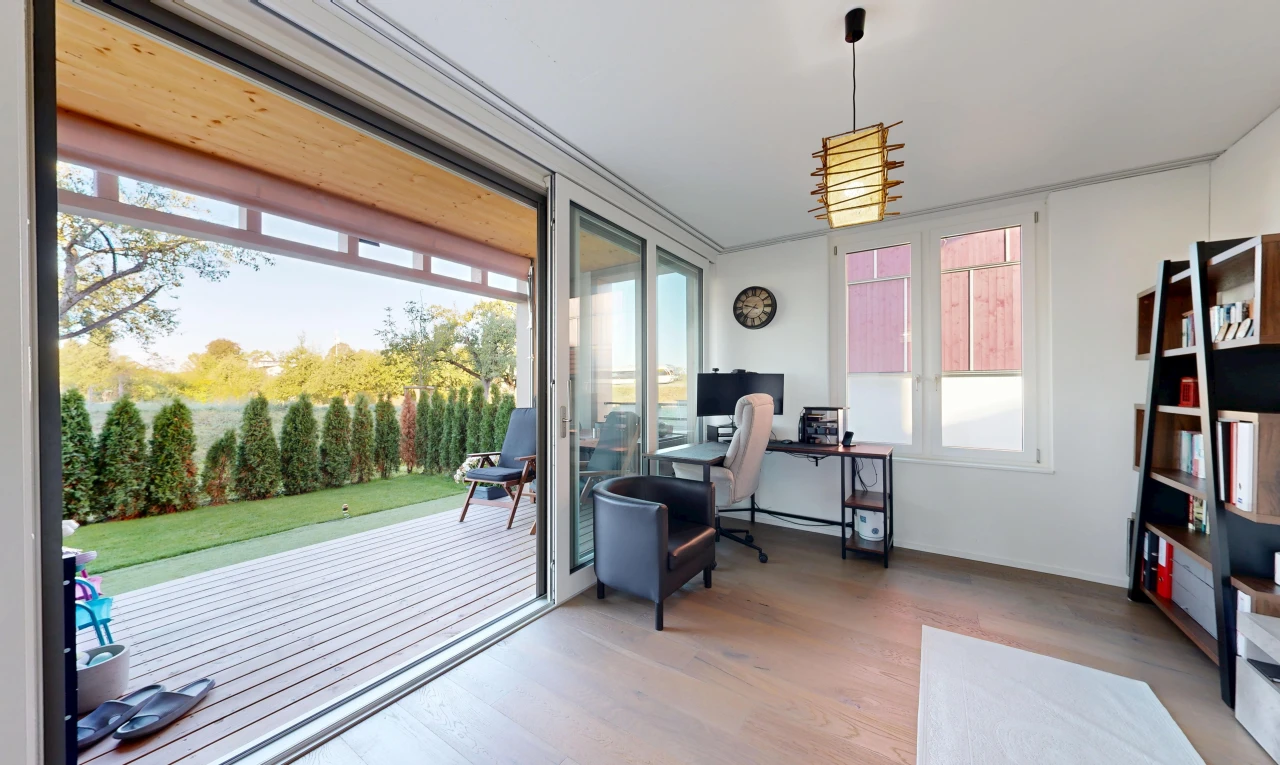 home office with access to exterior and wood finished floors