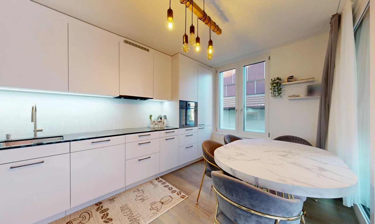 kitchen featuring modern cabinets, white cabinets, dark countertops, oven, and light wood finished floors