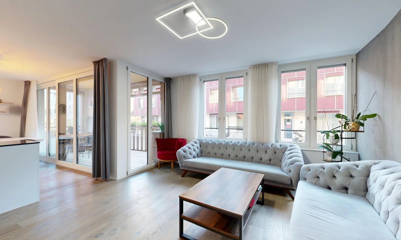 living area featuring access to outside, plenty of natural light, and light wood-type flooring
