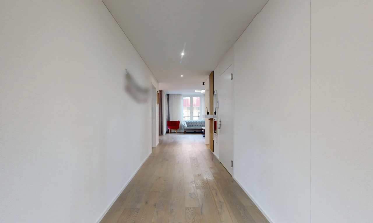 hallway featuring light wood-type flooring and recessed lighting