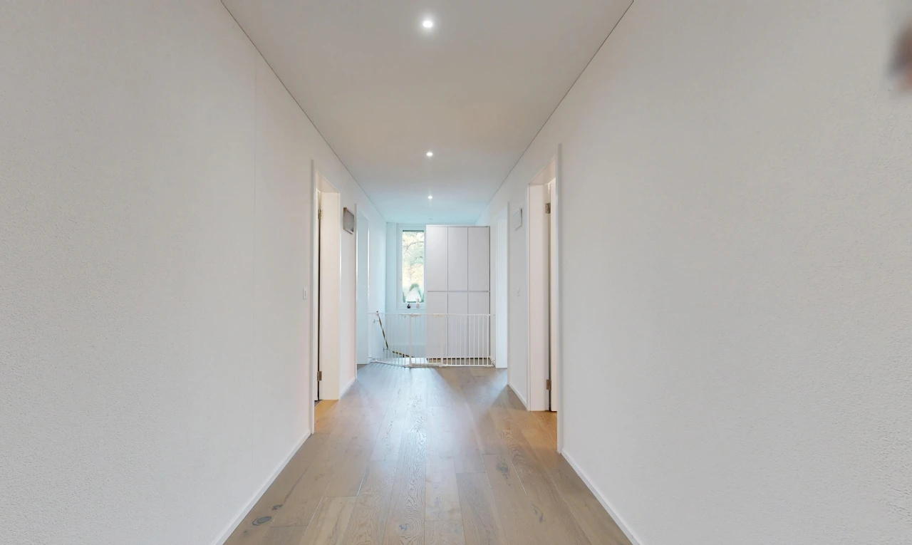 hallway with recessed lighting and light wood-style floors