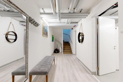 hallway featuring stairs and light wood-style flooring