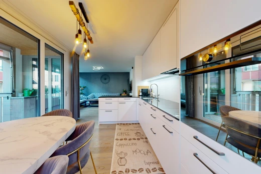 kitchen with oven, access to outside, a peninsula, white cabinetry, and light wood finished floors