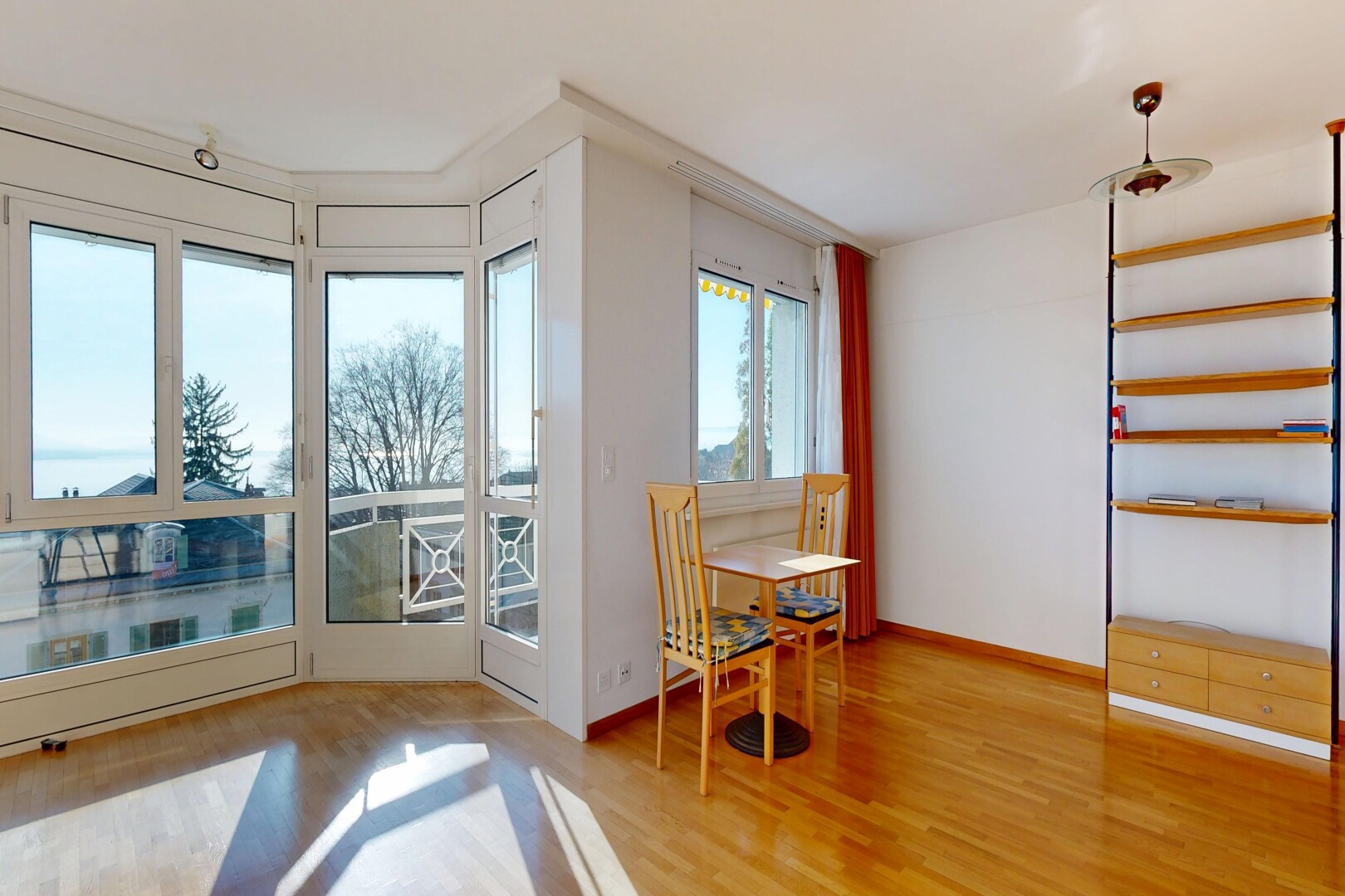 dining space featuring light wood finished floors and baseboards