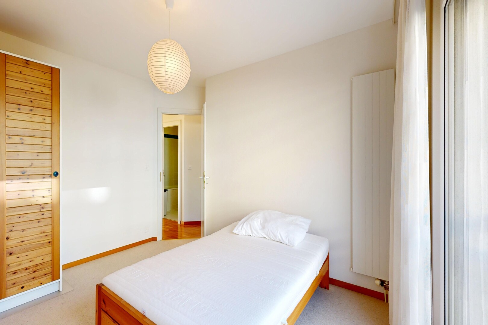 room / bedroom with light carpet and baseboards