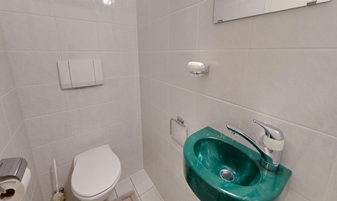 bathroom featuring tile walls and light tile patterned floors