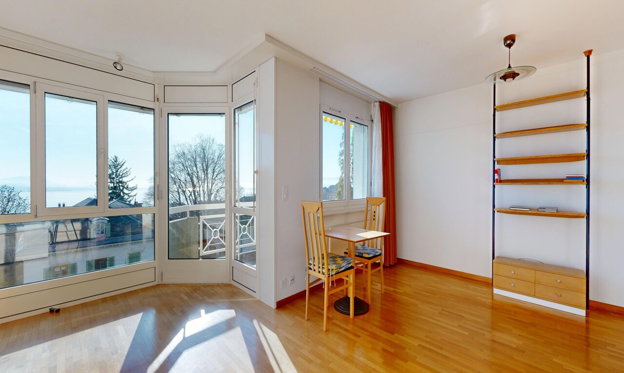 dining space featuring light wood finished floors and baseboards