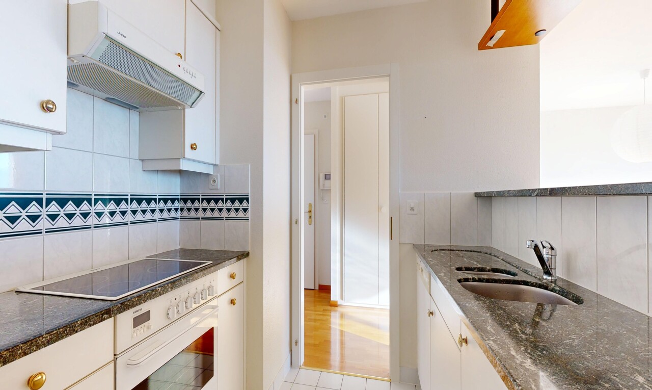 kitchen featuring exhaust hood, white cabinets, oven, tasteful backsplash, and black electric cooktop
