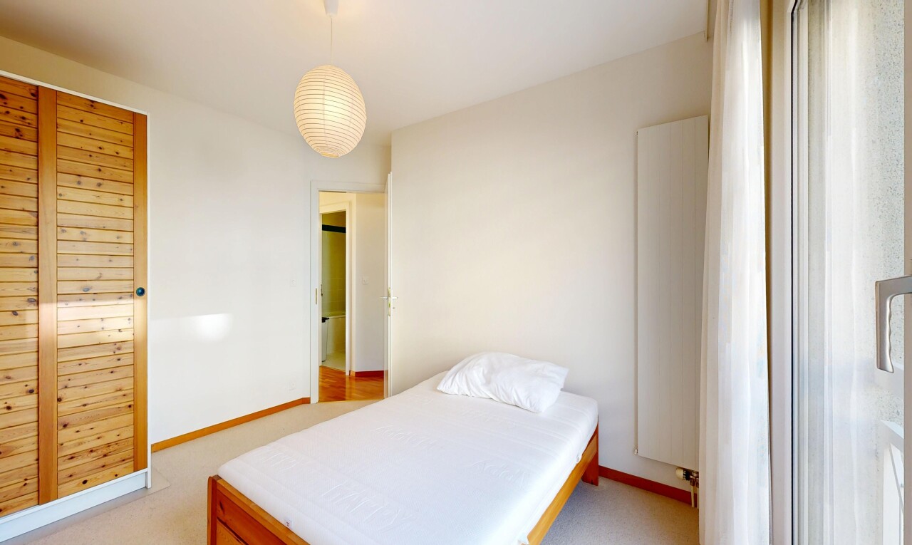 room / bedroom with light carpet and baseboards