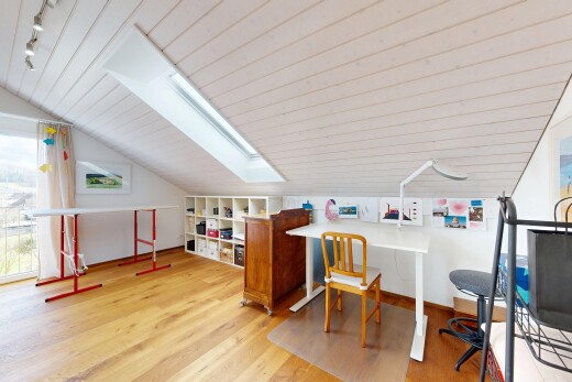 office space featuring a skylight, light wood-type flooring, rail lighting, and a vaulted wood ceiling