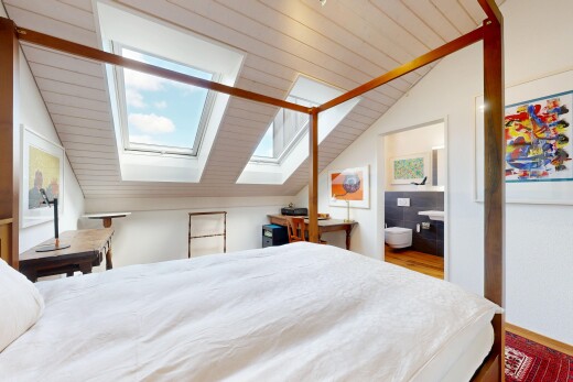 room / bedroom with a skylight and vaulted ceiling