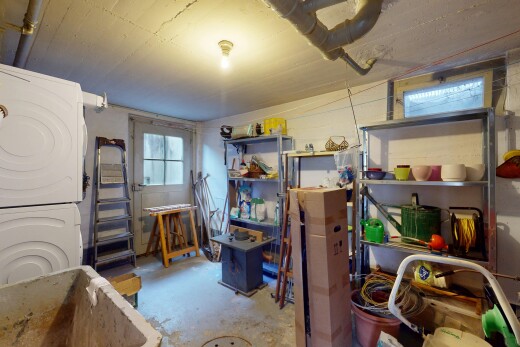 storage room featuring stacked washer and dryer