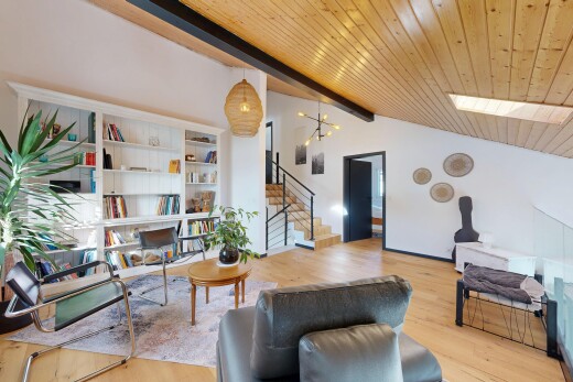 living area featuring stairway, wood finished floors, and wood ceiling
