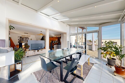 dining space featuring lofted ceiling and tile patterned floors