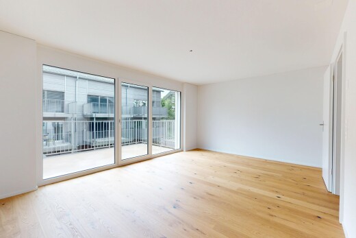 leerer raum mit gipskartonwand, drywall, holzfußboden, wood finish floor, und natürliches licht