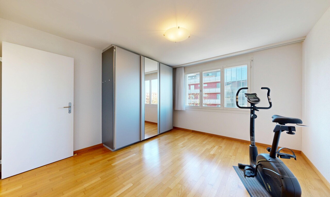 workout area with light wood finished floors