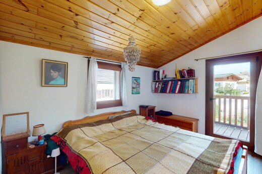 room / bedroom featuring lofted ceiling, multiple windows, a chandelier, wooden ceiling, and access to outside