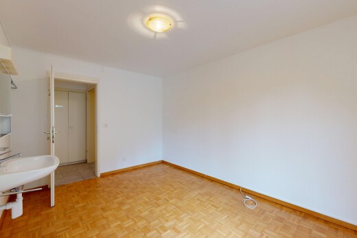 pièce vide avec drywall, cloison sèche, inside property, parquet floor, et baseboards wall