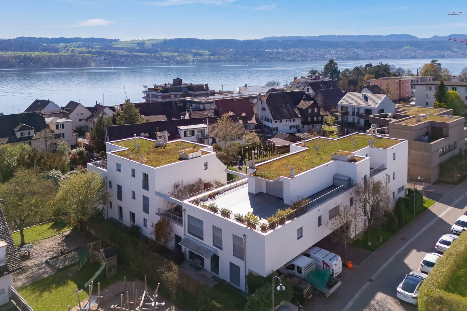 view of building exterior with a water view and a residential view