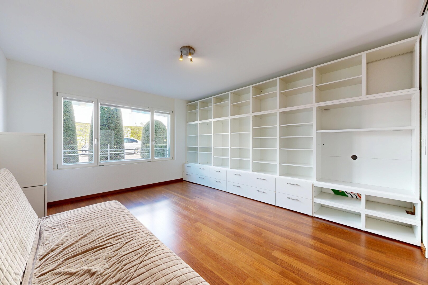unfurnished room with light wood-style flooring and baseboards