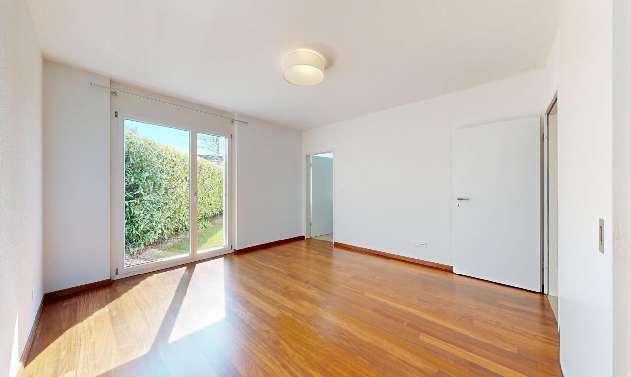 empty room with light wood-style floors and baseboards